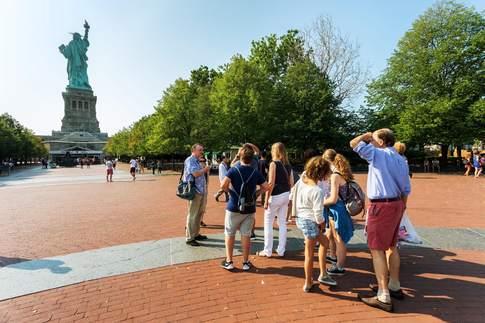 participants of Walks of New York visit the Statue of Liberty